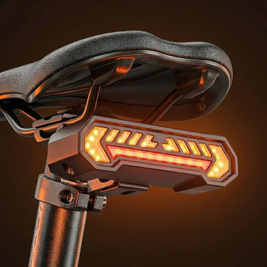 Bicycle seat with a glowing orange light on a dark background